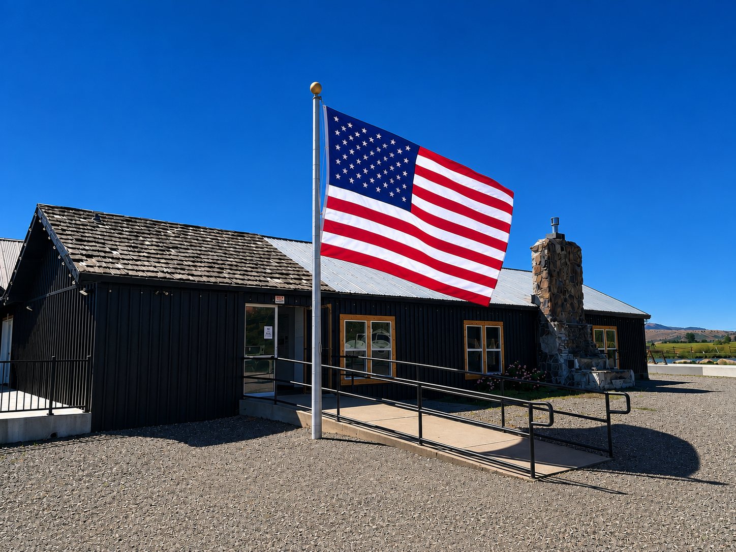 Front of Hunters Hot Springs Resort with American flag